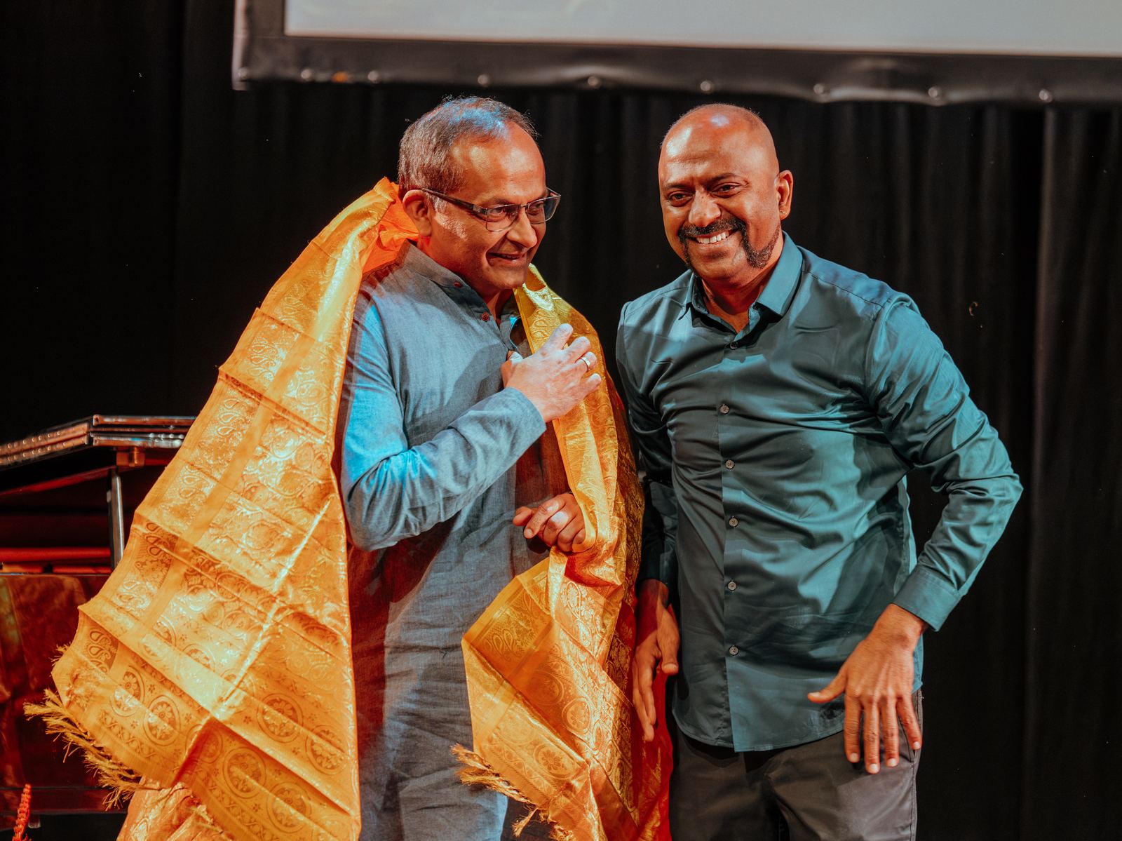 A guest honoured with a golden shawl