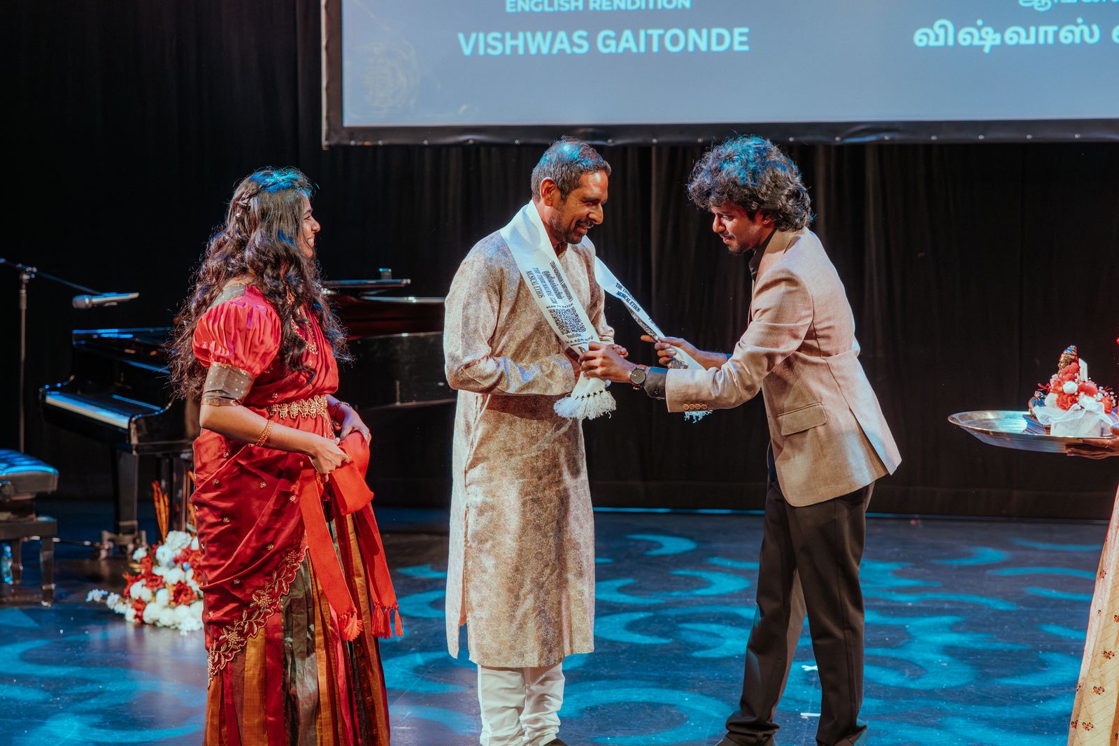 A guest receiving an award on stage