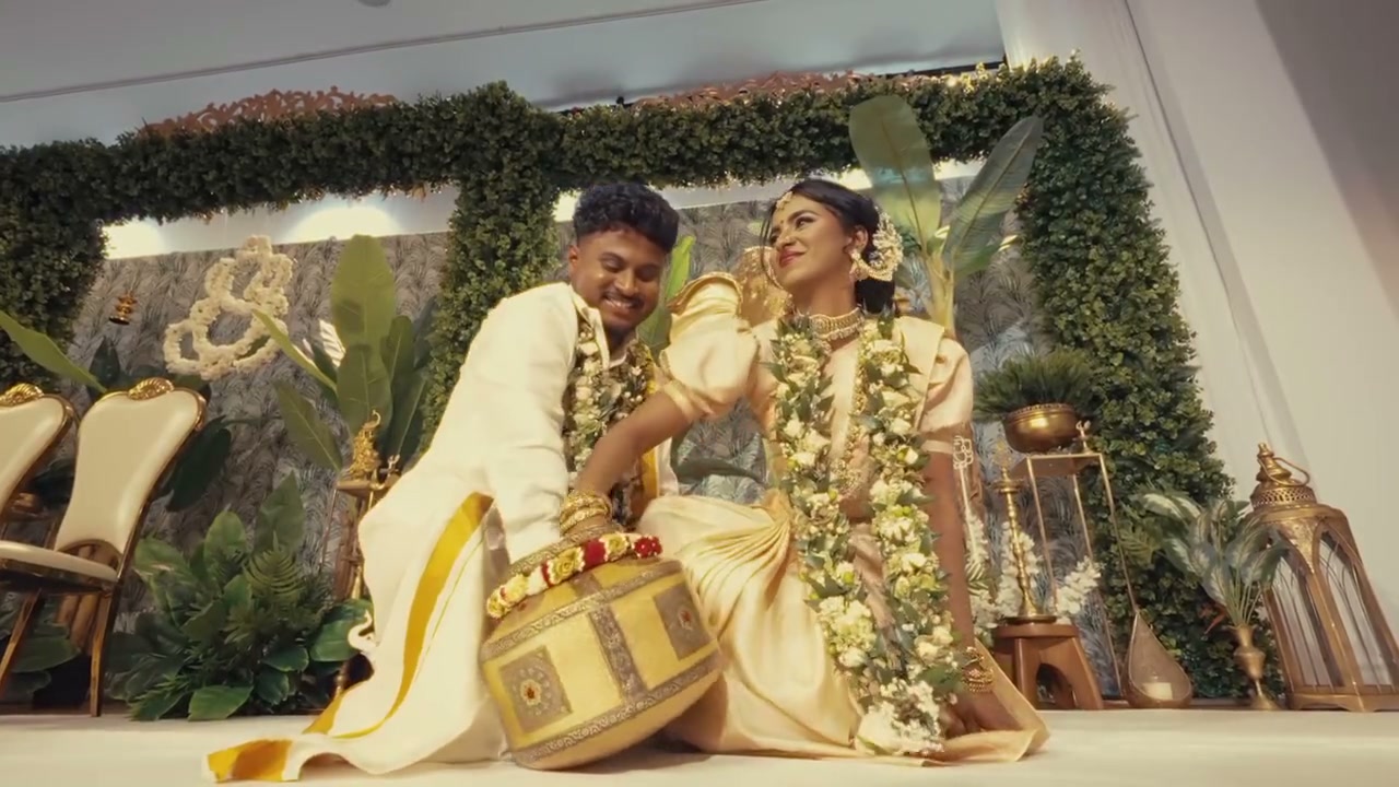 Bride and groom in gold silk at their wedding ceremony